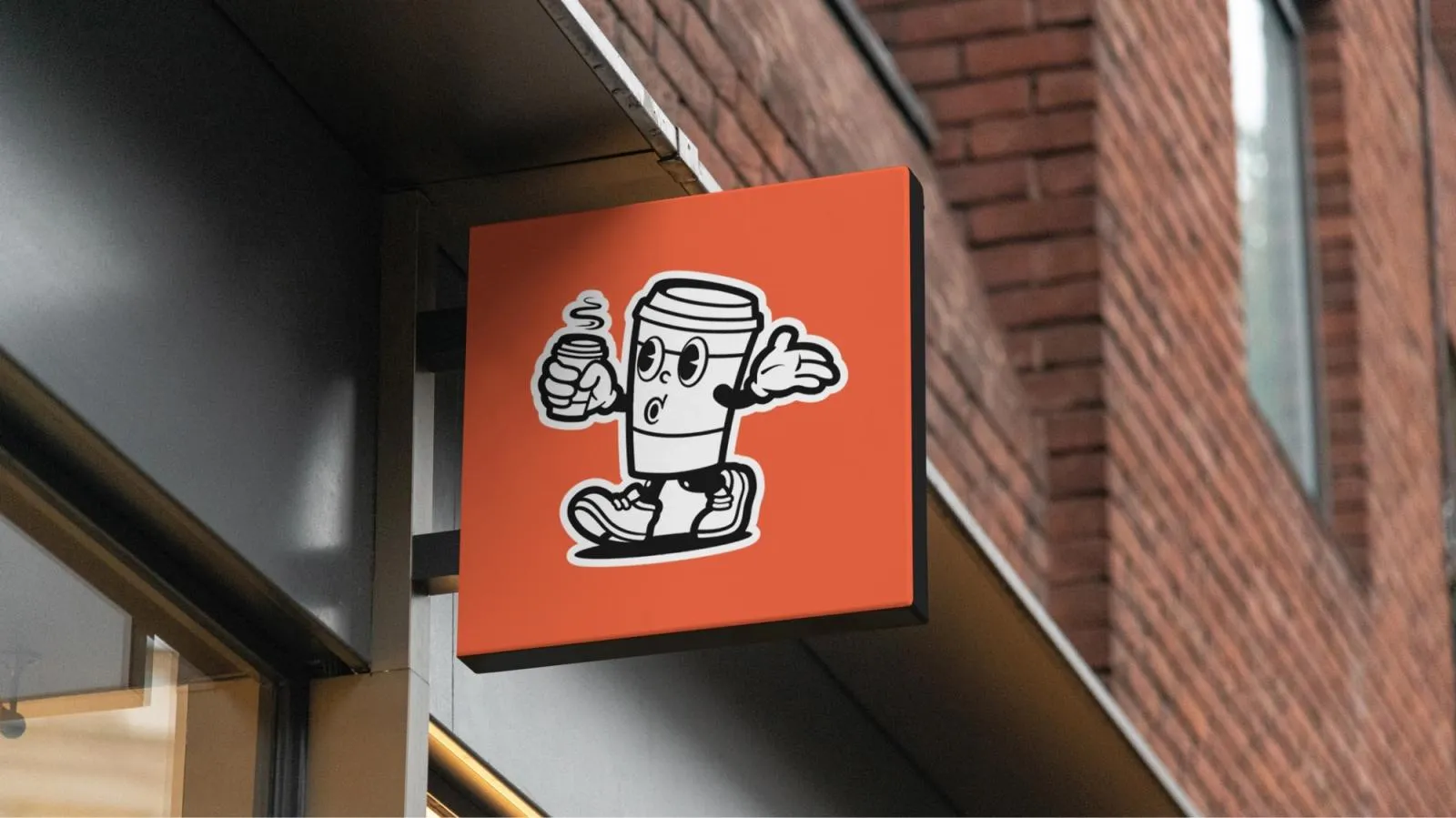 Orange Coffee Heads shopfront sign featuring the retro walking coffee cup mascot