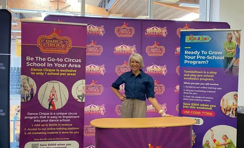 Dance Cirque trade show stand with pull-up banners for dance studio owners and the TumbleTown pre-school program