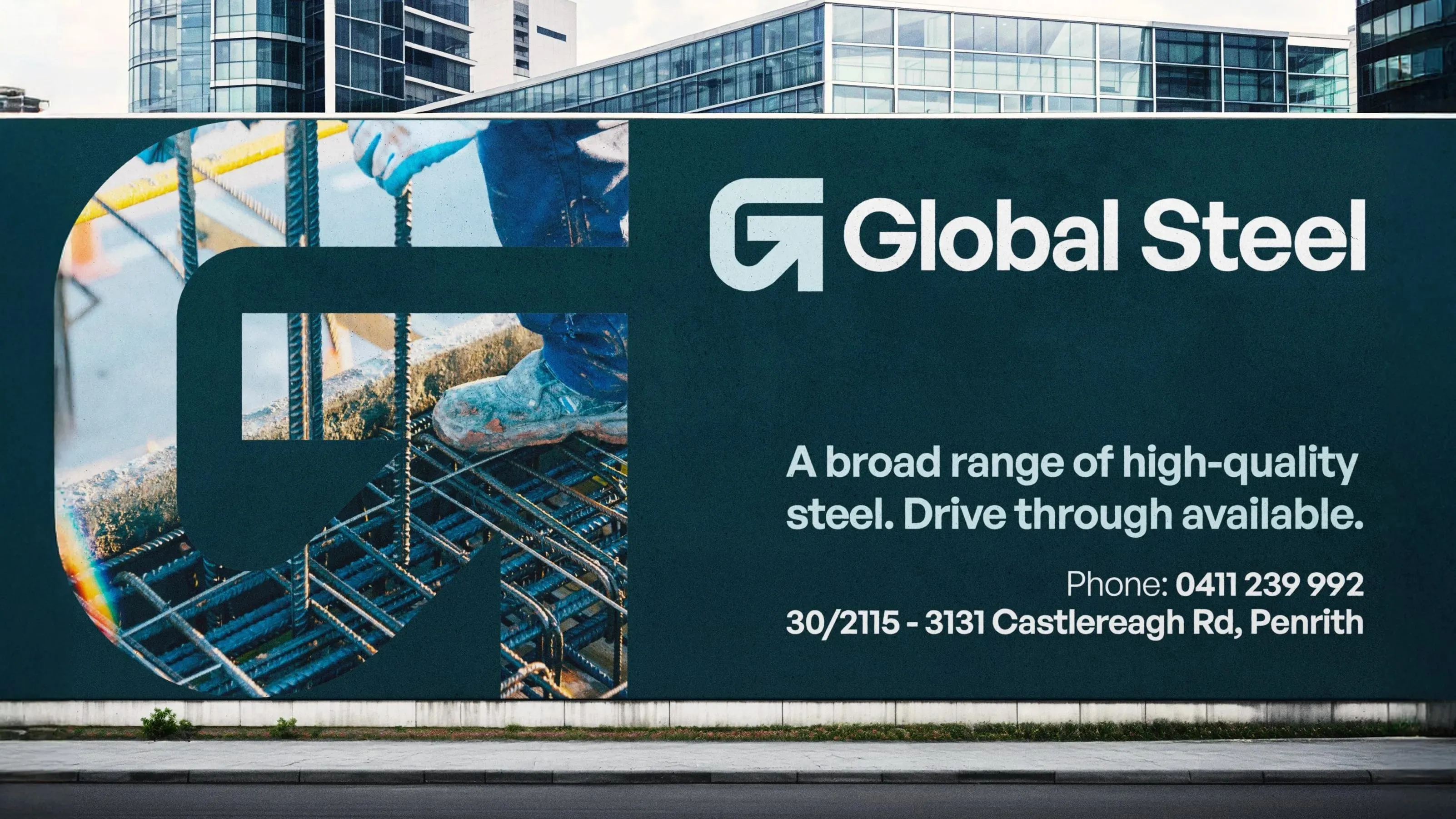 Global Steel hoarding in Penrith advertising a broad range of high-quality steel, with drive through available