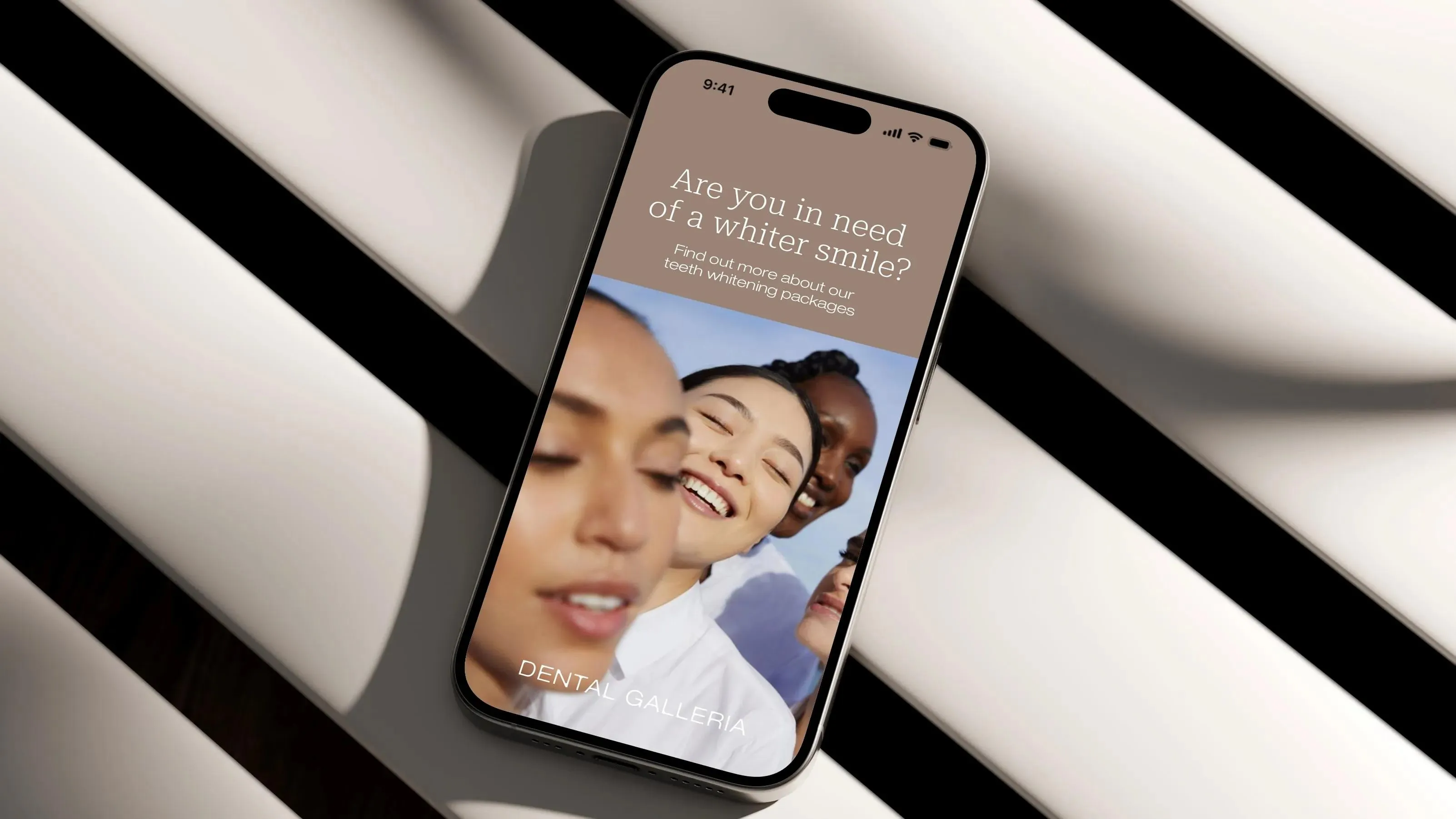 Phone showing a Dental Galleria teeth whitening ad that asks "Are you in need of a whiter smile?"