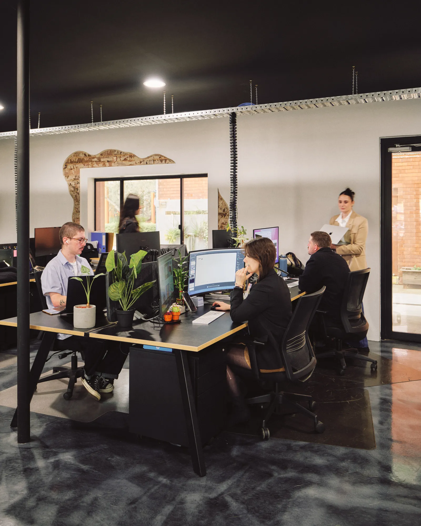The Q Agency team at work in the Penrith studio